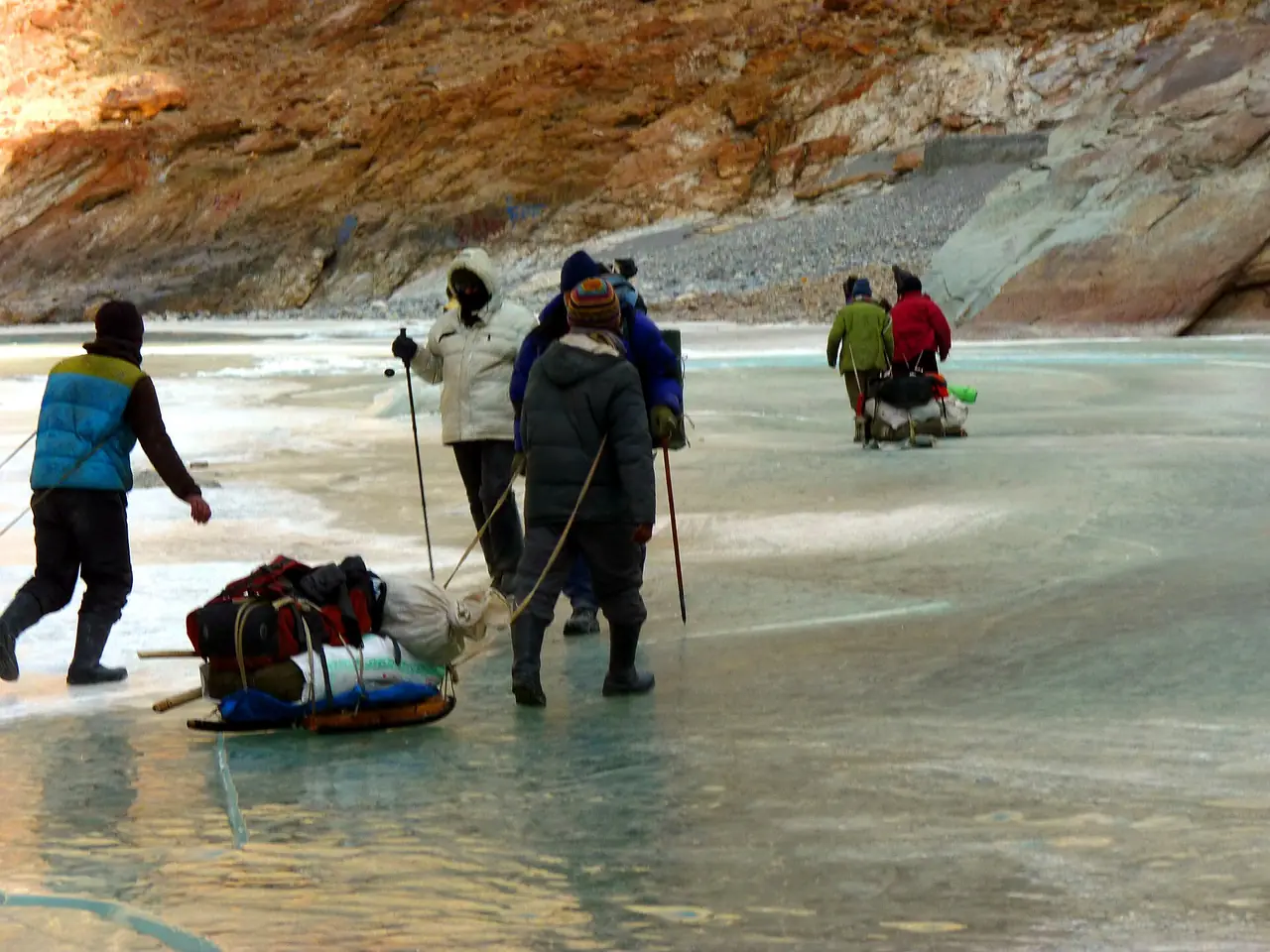 Trekkers walking on the frozen Zanskar river