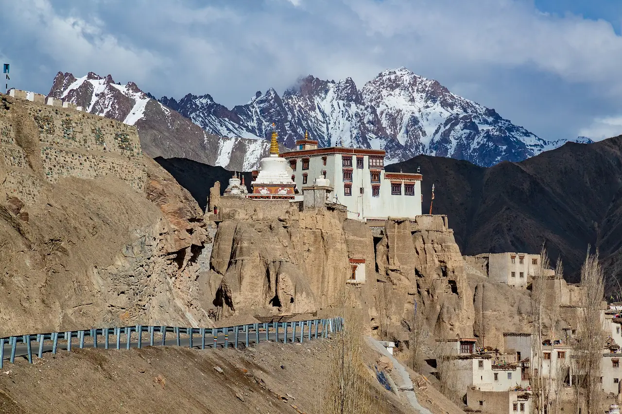 Lamayuru Monastery on its cliff with peaks behind